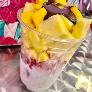 Coconut ice cream on the bottom w/ fruit salad on top - pineapple, mango, &amp; strawberry - so good - hot chocolate fudge on top