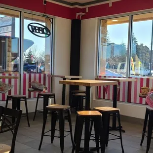 a woman sitting at a table in a restaurant