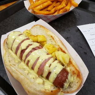 Hawaiian hot dog with seasoned fries