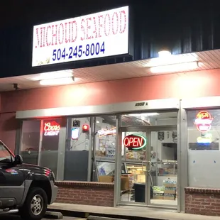 a car parked in front of a restaurant