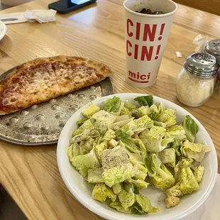 Cheese pizza and Caesar salad.