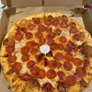 a pepperoni pizza in a box