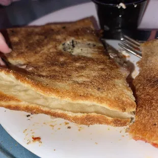 the back (curved part of the "calzone") where they didn't even bother to join the PIZZA CRUST together. very authentic (not)