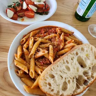 a plate of pasta and bread