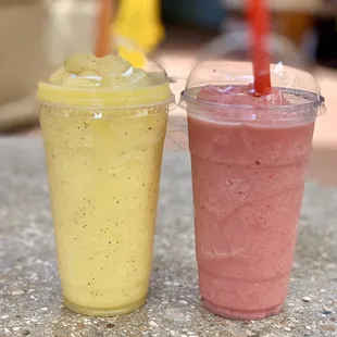 two smoothie drinks on a table