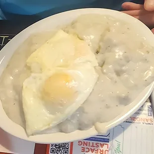 Huge, heart stopping biscuits and grave with sausage and fried eggs! Not my meal!