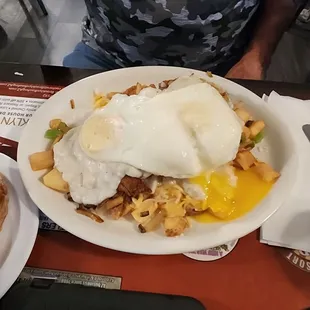 Potatoes, sausage, gravy with eggs