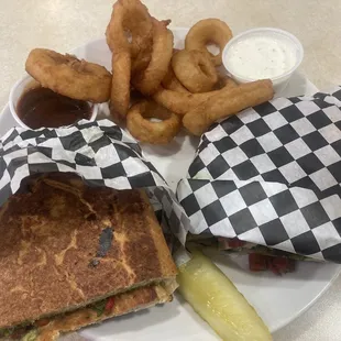 Gourmet Pesto chicken sandwich w/onion rings, and a side of homemade ranch &amp; Bar-b-a.