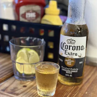 a bottle of corona extra and a shot of lemonade