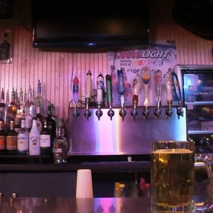 a bar with a variety of beers