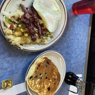 The 2's (blueberry pancakes and bacon with over-medium eggs) plus O'Brien hashbrowns.  Yum!!!