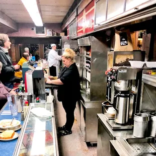 The cooks and diners at the counter