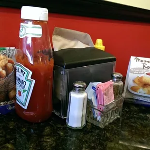 a hot dog, ketchup and condiments