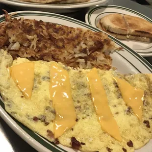 Bacon &amp; Cheese Omelette with hash browns, rye toast, and pancakes