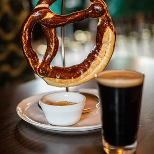 Large pretzel served with beer cheese, perfect snack while watching the World Cup