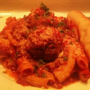 a plate of pasta and a hot dog