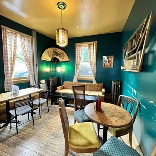 a dining room with tables and chairs