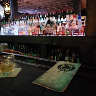 a bar with alcohol bottles