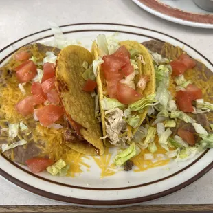 Tuesday taco special beef, chicken, and carne adovada tacos