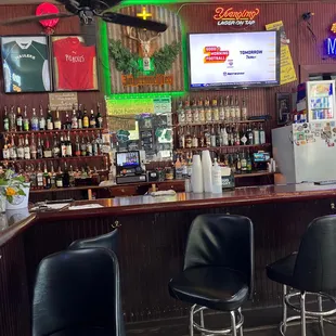 a bar with neon signs