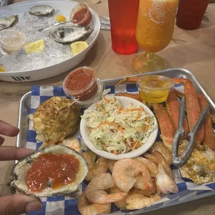 Crab cake, snow crab legs, steamed shrimp and a side of Cole slaw