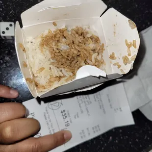 Looks like used rice. Didn't order white rice with soy sauce added. First n last time ordering here.