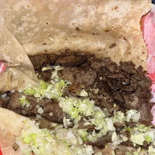 I ordered a carne asada burrito with beans and cheese. No beans or cheese in sight.