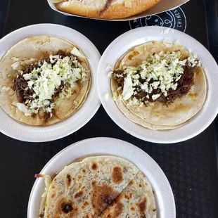 At the top a Sonoran dog, birria tacos in the middle and a small beef caramelo