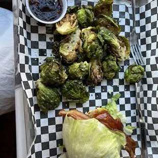 Bacon cheeseburger on lettuce instead of a bun with Brussels sprouts.