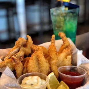 a basket of deep fried shrimp