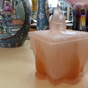 Vintage pink glass box with loving penguins.