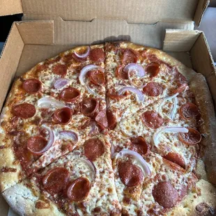 a pepperoni and onion pizza