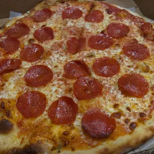a pepperoni pizza in a box