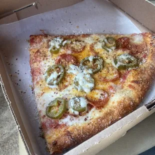 a slice of pizza in a box