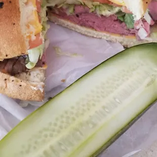 The Beef Sandwich on an onion roll and a side pickle.