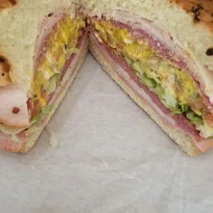 The Mid Eight Monster Sandwich with Love Spice on an onion roll.