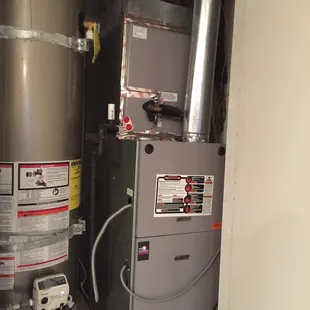 Furnace and A/c combo  next to water heater in central water heater closet.