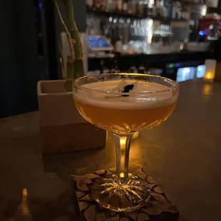 a cocktail in a coupe glass