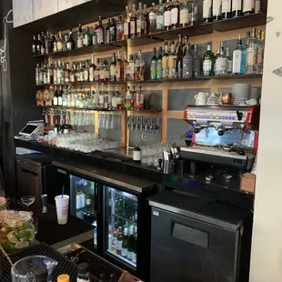 a bar with a variety of drinks