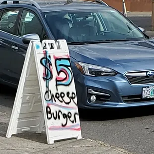 a blue subaruna parked in a parking lot