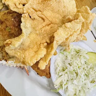 Seafood  platter comes with thin catfish, stuffed crab, fried shrimp, fried oyster, hash poppies, coleslaw and French fries.