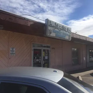 a car parked in front of the store