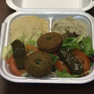 a meal in a styrofoam container