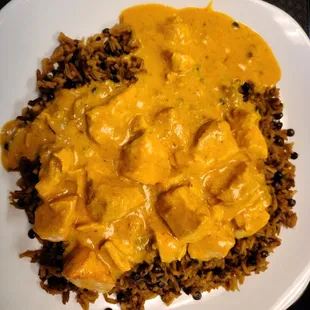 Spicy butter chicken with lentil rice