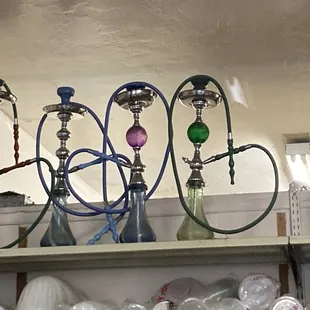 a variety of hook - ons on a shelf