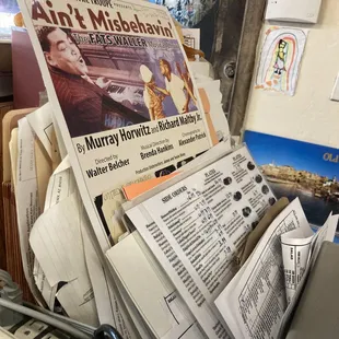 a pile of newspapers on a desk