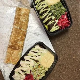 two trays of food on a table