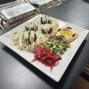 Falafel Rice Plate! Includes pickled veggies, choice of salad, and hummus!