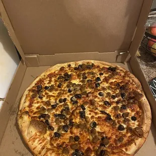 Light sauce, black olive, sausage pizza! Actually pretty good.