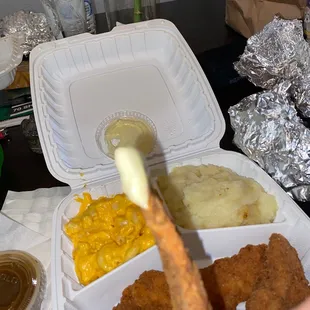 a hand holding a piece of food